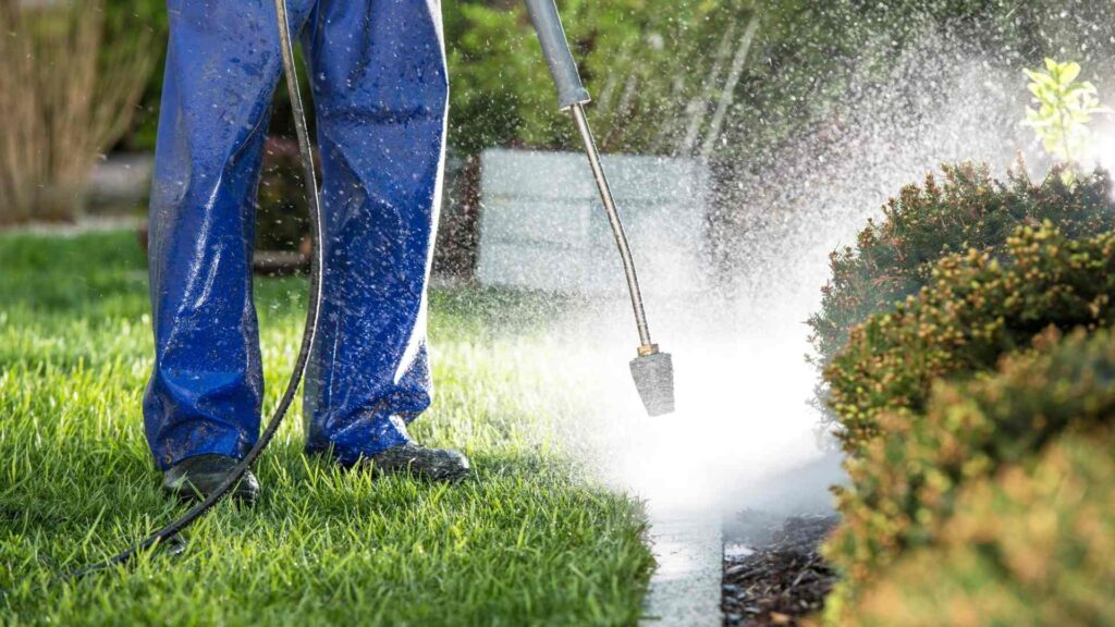 Power Washing washes a garden landscape